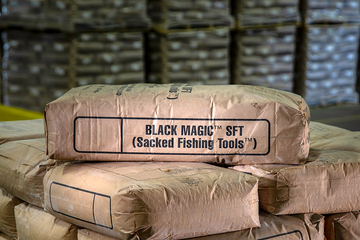 Photo of a bag of BLACK MAGIC spotting fluids in the warehouse.