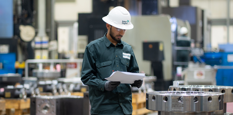 Photo of a Baker Hughes engineer working in the machine shop.